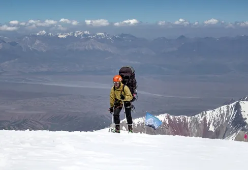 A tired climber stepping into C3